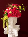 Crimson and pink rose luxury floral arrangement in sculptural face vase by Nostalgie Flowers Los Angeles
