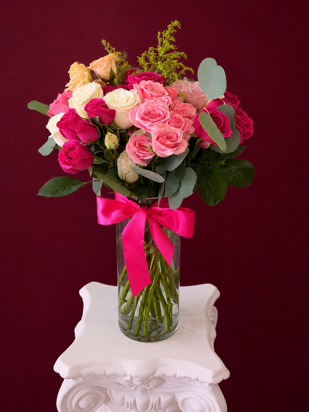 Fuchsia Romance vase arrangement with hot pink, blush, ivory and peach roses, eucalyptus and a pink satin ribbon