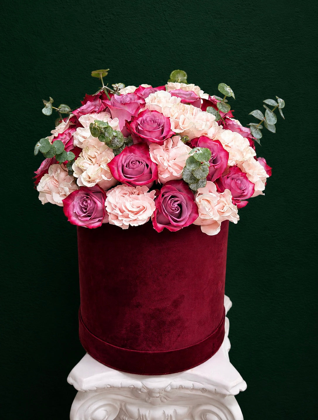 Burgundy velvet flower box with pink and lavender roses, blush hydrangeas, and eucalyptus by Nostalgie Flowers
