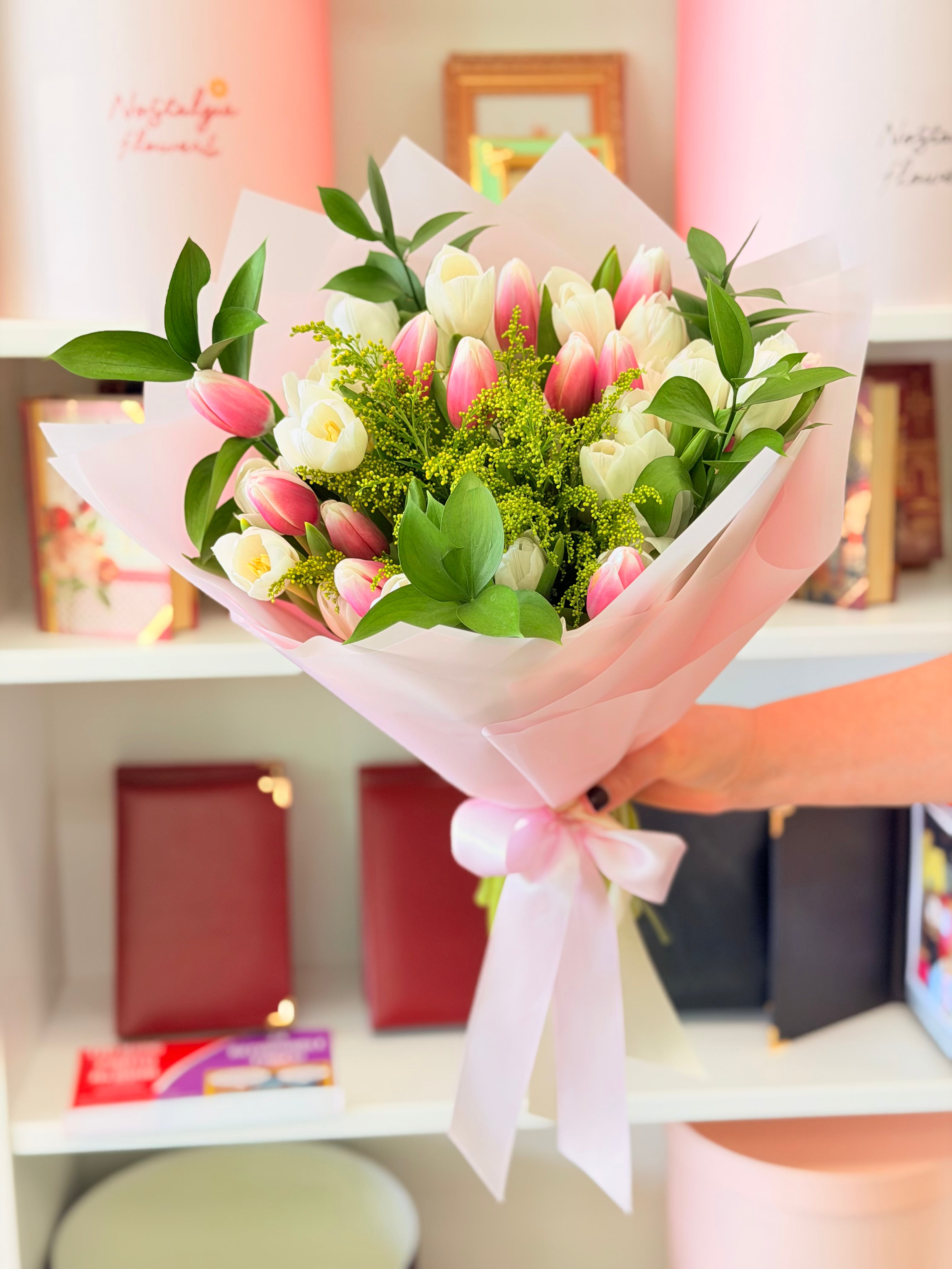Pink and white tulip bouquet with fresh greenery and blush wrapping by Nostalgie Flowers Los Angeles